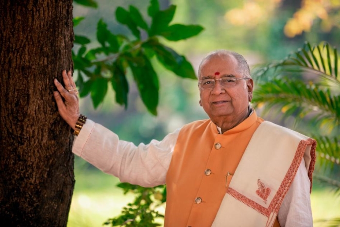 shreeguru balaji tambe standing besides tree 700x467